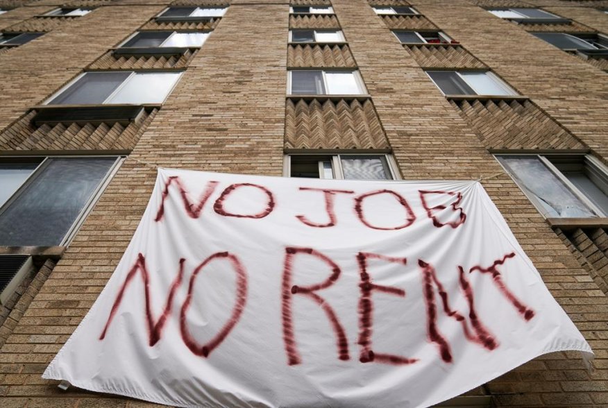 Residents of Meridian Heights apartments in Northwest Washington display a painted bedsheet protesting for the cancelation of rent due to the loss of jobs during the coronavirus disease (COVID-19) pandemic in Washington, D.C., U.S., August 20, 2020. REUTE