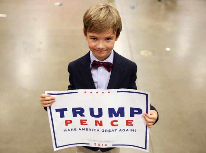 Cole Baird, 8, supporter of Republican presidential nominee Donald Trump, poses for a portrait following a campaign rally in Fredericksburg, Virginia, U.S., August 20, 2016. REUTERS/Carlo Allegri