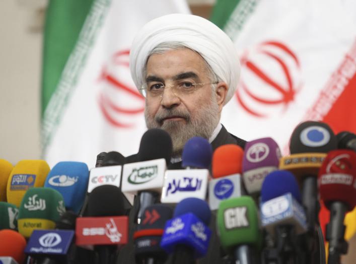 Iranian President Hassan Rouhani speaks with the media during a news conference in Tehran.