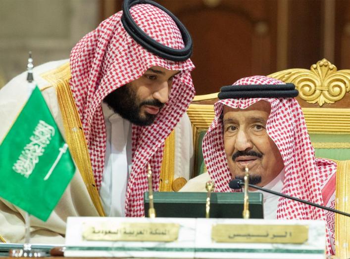 FILE PHOTO: Saudi Arabia's Crown Prince Mohammed bin Salman talks with Saudi Arabia's King Salman bin Abdulaziz Al Saud during the Gulf Cooperation Council's (GCC) Summit in Riyadh, Saudi Arabia Dec. 9, 2018. Bandar Algaloud/Courtesy of Saudi Royal Court/